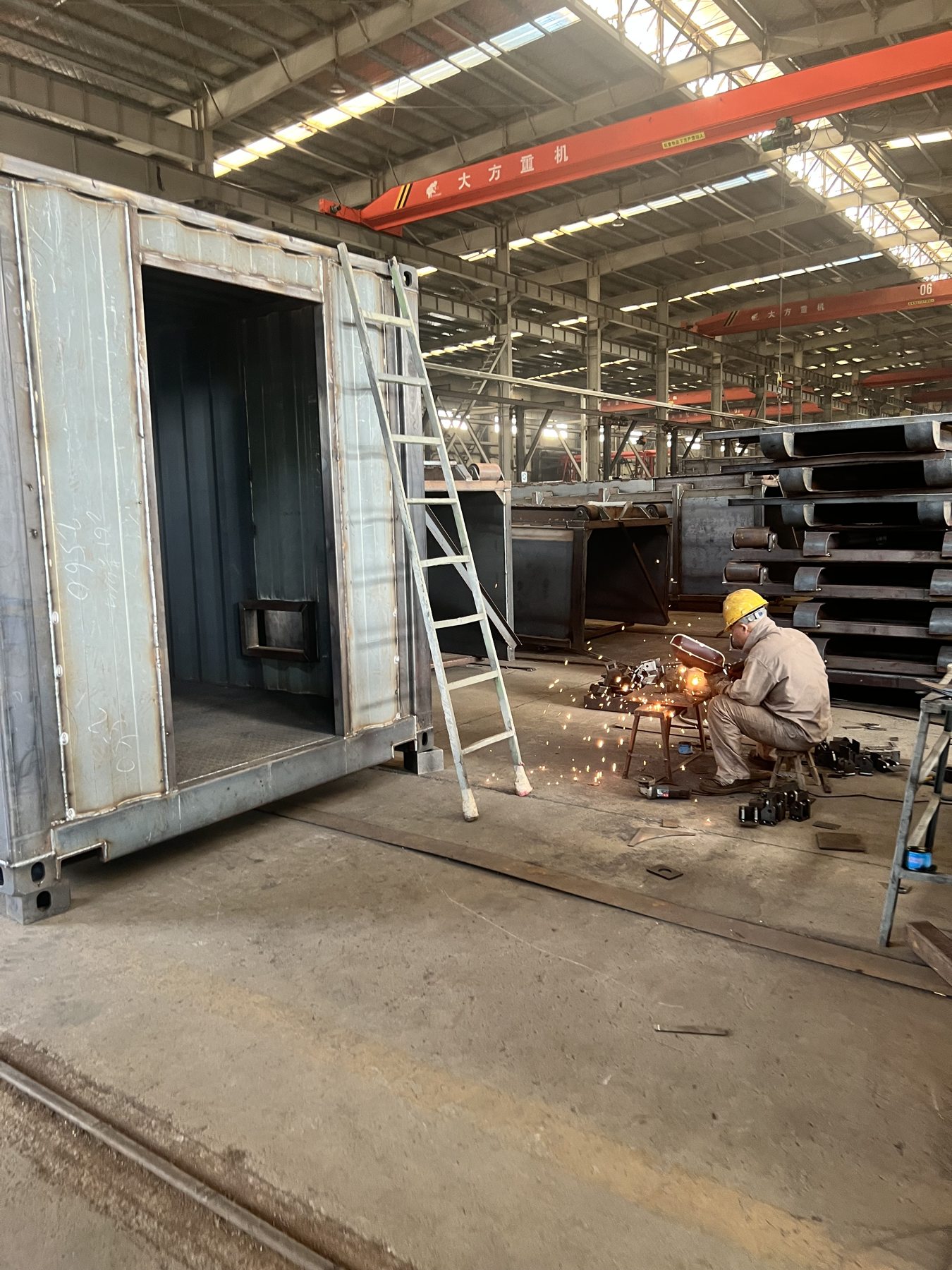 Container enclosure undergoing fabrication inside the workshop